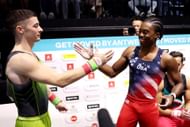 Gold medalist Rhys McClenaghan celebrates with silver medalist Khoi Young after the Men's Pommel Horse Final at the 2023 Artistic Gymnastics World Championships in Antwerp, Belgium
